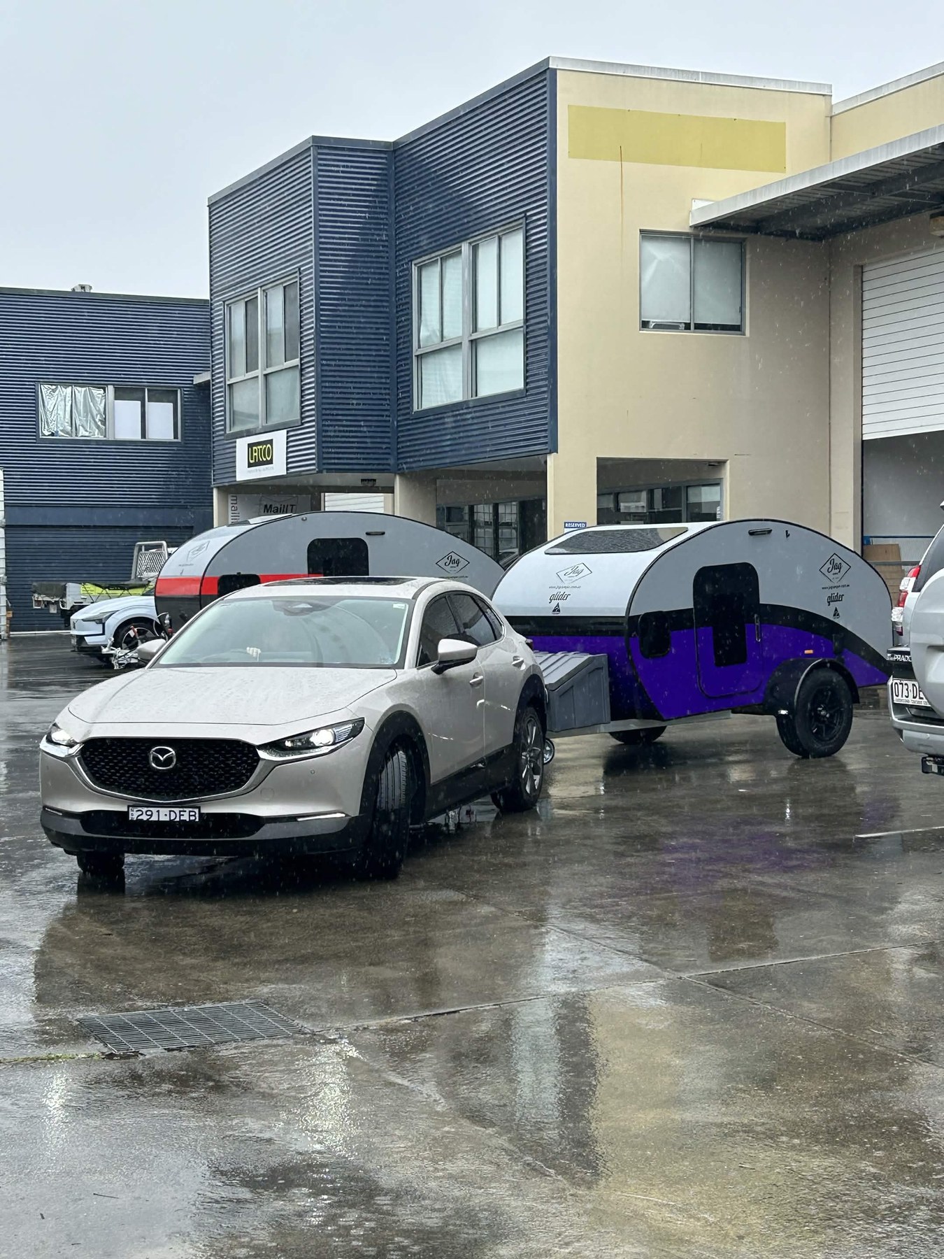 JAG Camper Teardrop and Glider campers outside the workshop in wet weather.