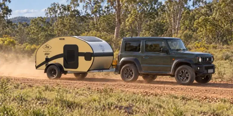 JAG Glider lightweight offroad Teardrop Camper being towed by a suzuki Jimny in the australian bush